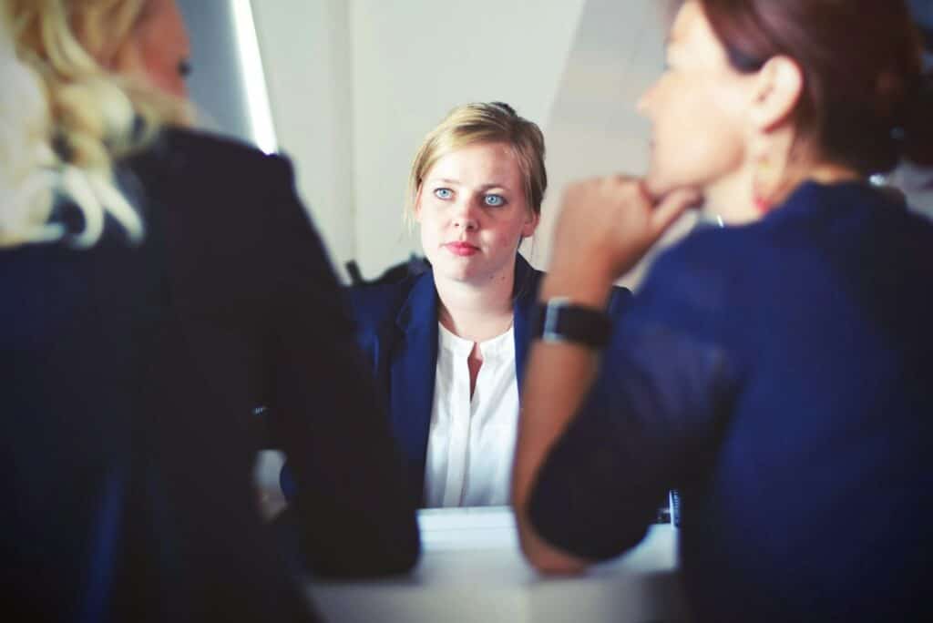 Understanding Business Income Insurance: Protect Your Revenue Stream 2 three women sitting beside table